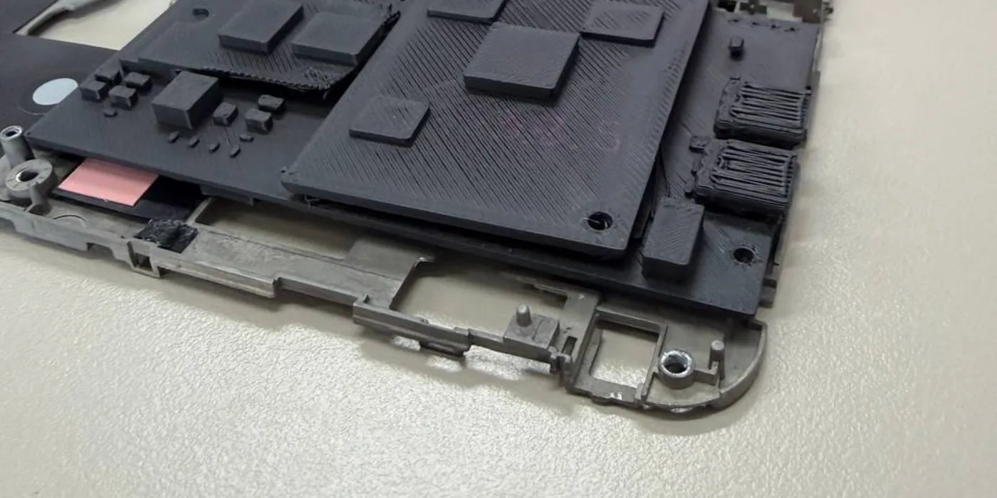 A 3D-printed carrier mock-up sitting in the stripped VAIO P chassis