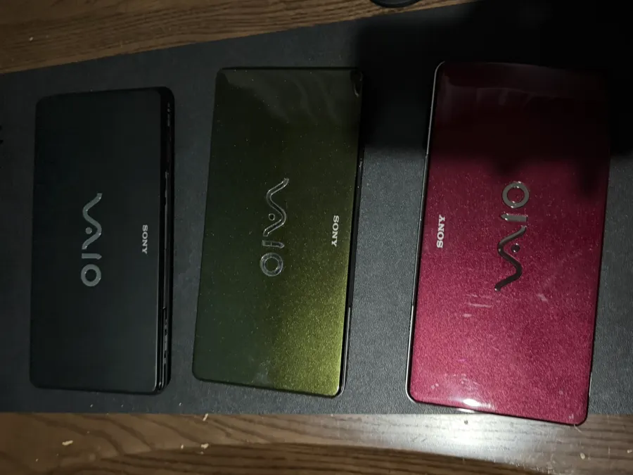 Three Sony VAIO P laptops in black, green and red