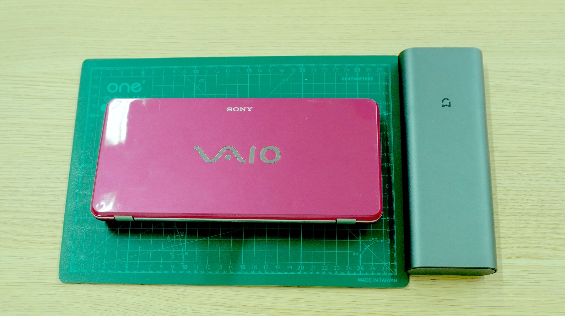 Closed pink Sony VAIO P laptop used as the donor body for a Raspberry Pi CM5 motherboard replacement