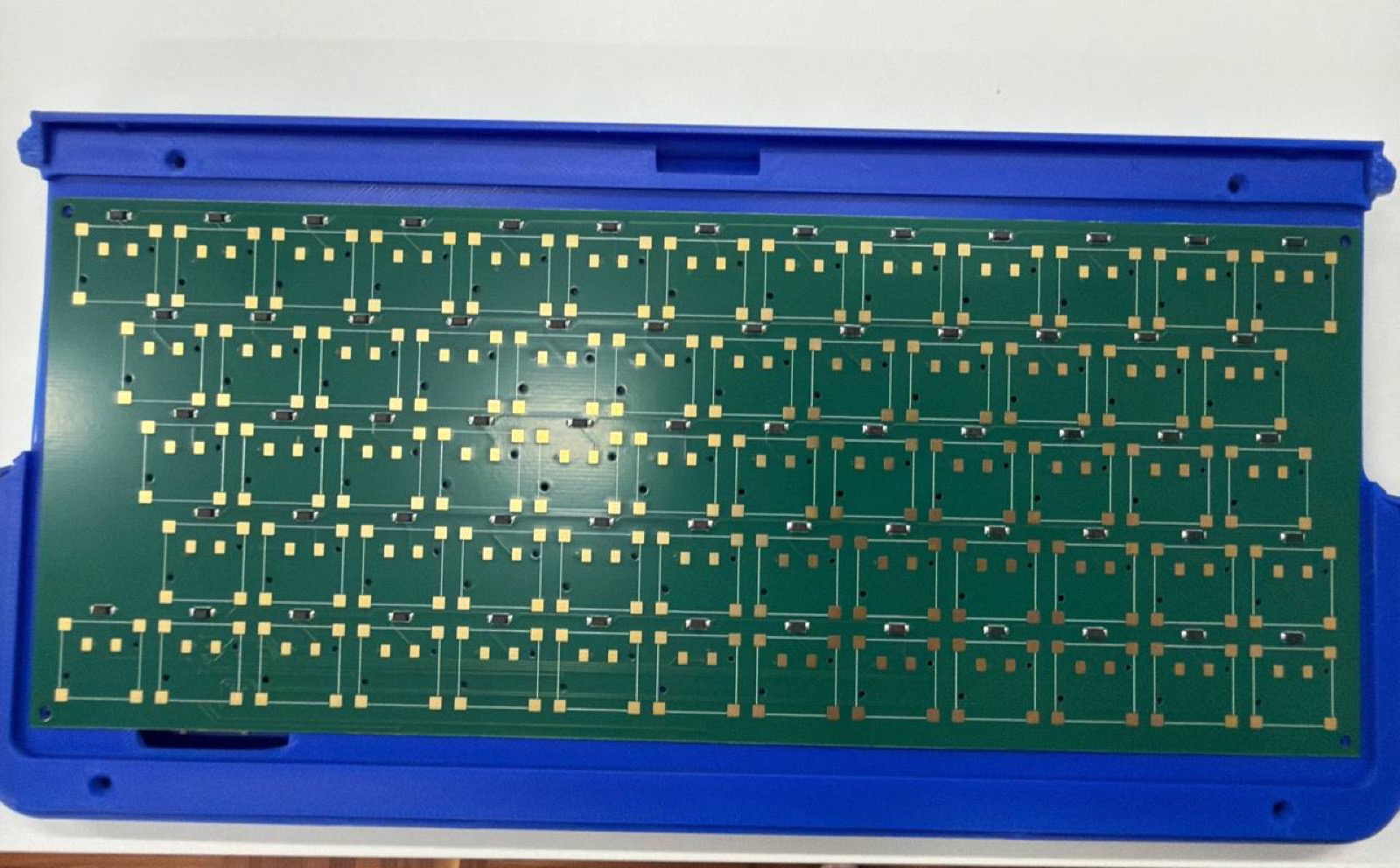 Keyboard matrix PCB laid into a blue Sony VAIO P keyboard shell for USB HID controller planning